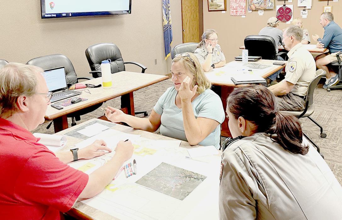 Steering committee members discuss the future of Valentine and the surrounding area. You’re invited to attend the Master Plan Public meeting, March 15, from 5:30 - 7:00 p.m. Photo by Kat Shiffler