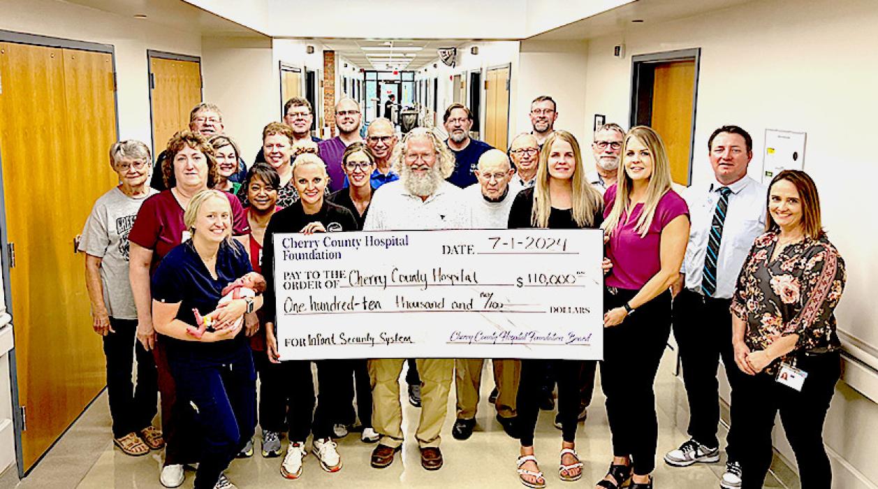 Pictured are front row, L to R: Myriah Wobig, Kelly Anderson, S. Rourke Springer, Lacey Joseph, Talia Benson, Melissa Williams. Second row, L to R: Becky Assarsson, Rowena Cruz, Jessica Abbott, Jerry Henderson, Steve Brown, Jim Bargen. Third row, L to R: Carol Luther, Lori Gaydusek, Char Steager, Dave Nelsen, Monty Neiffer. Back row, L to R: Steve Isom, Duane Lamb, Joseph Docker, Tracy Ray, and Josh Krueger.