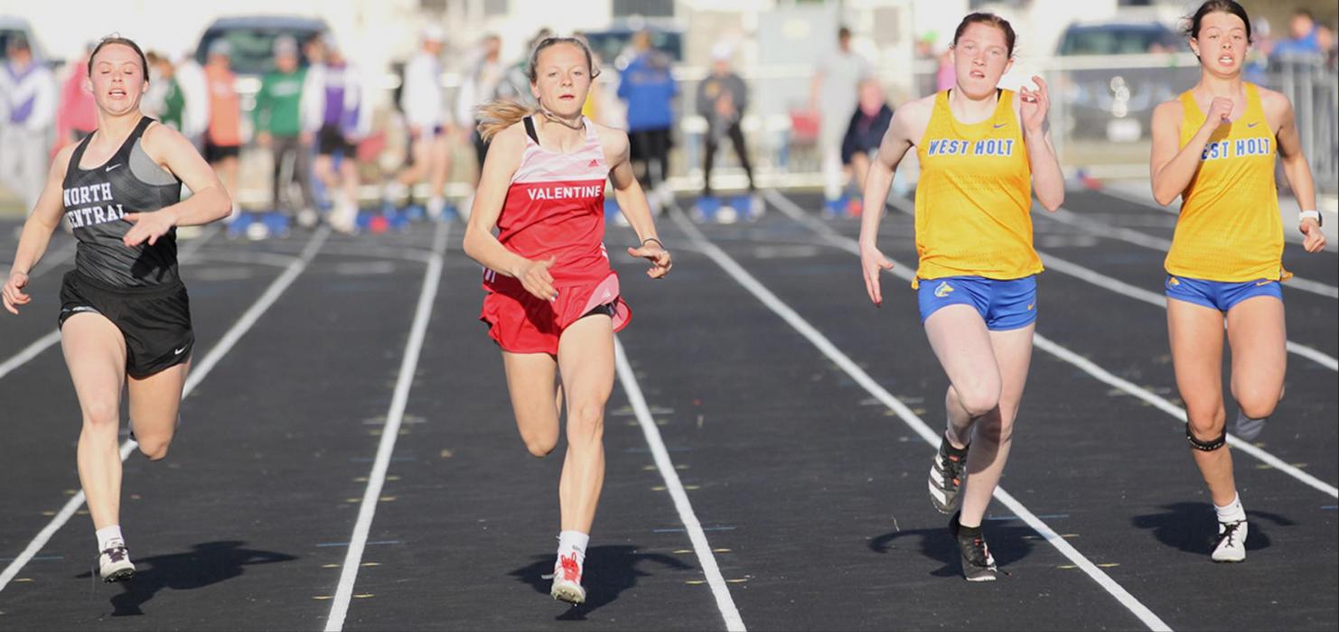 Tacey From, second in from the left, took first place in the 100 Meter Dash at the West Holt Invitational. Photos by Amanda Long