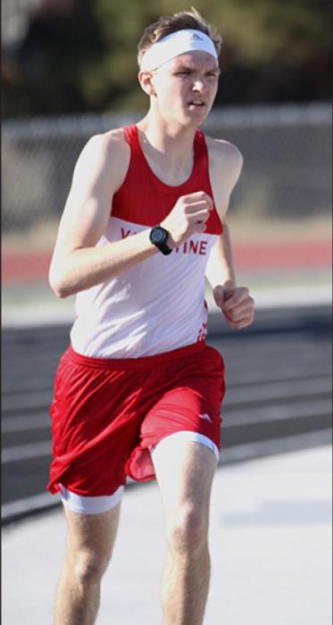 Above, Grant Springer placed second in the 3200 Meter Run with a time of 11:06.40.