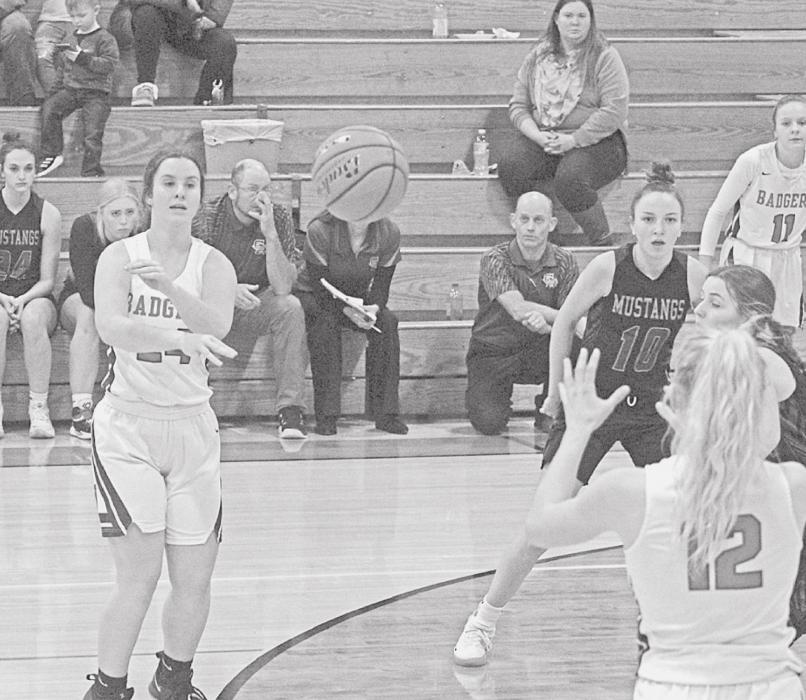 In the game against Gordon-Rushville, Ava Reagle #24 makes a pass to Kailee Kellum #12. The Lady Badgers won the home game with a score of 54-43. Photo by Mary Reagle