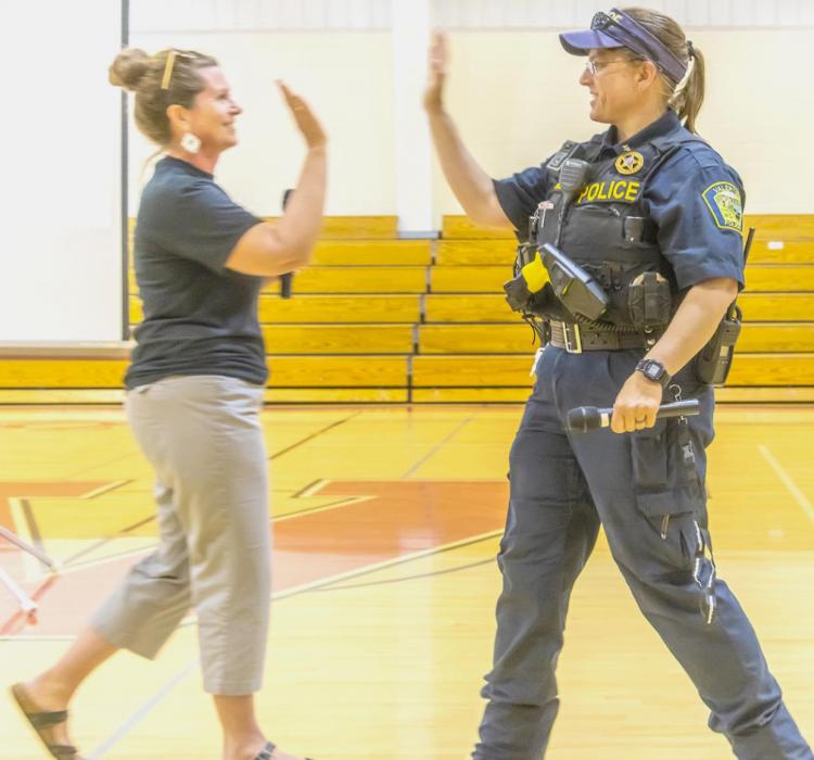 Jennifer Jackson and Chief Dana Miller go for a high five greeting when it comes time to teach youth that it’s okay to not be okay!