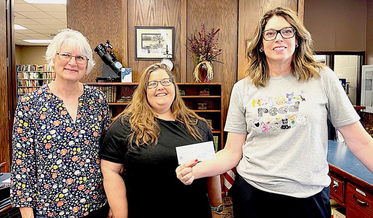 Pictured are from L to R: Janel Schubauer, Nichole Garwood, and Carrie Graham at the Valentine Public Library.