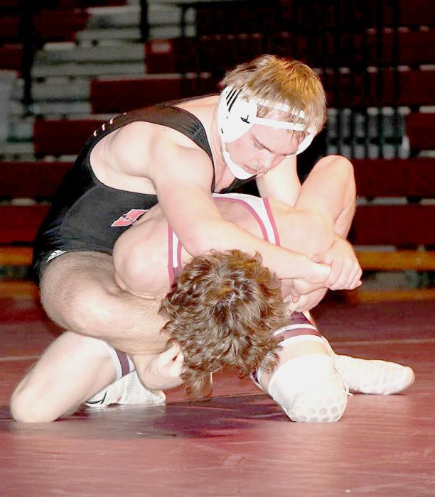 Cinch Miller, 152# has the upper hand over his opponent.