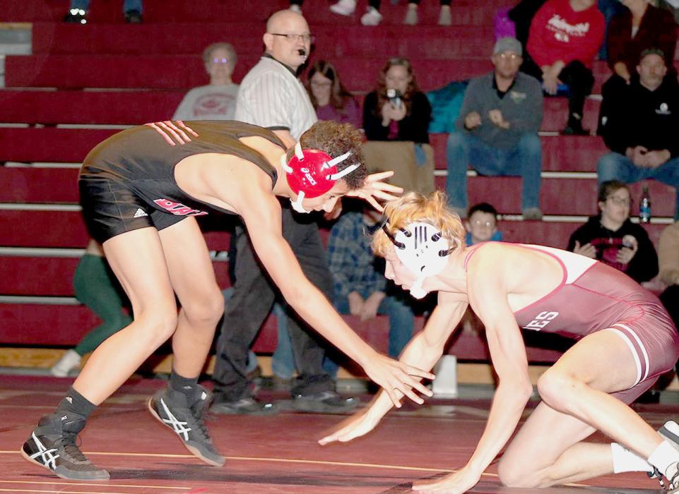 Jehki Williams begins to grapple with Gothenburg in the 120# weight class. Photos by Jessica Stankoski