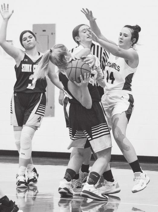 Photos by Shontell Roseberry Mikah VanderWey #14 and Ayden Naslund #5 are blocking Sioux County.