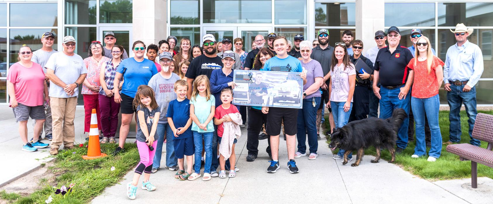 The community came out to support Valentine Police Officer Jasmine Hoefs who received a $10,000 grant from Zechariah Cartledge of Running 4 Heroes, and a Law Enforcement Purple Heart from the Valentine Police Department. Photos by Laura Vroman