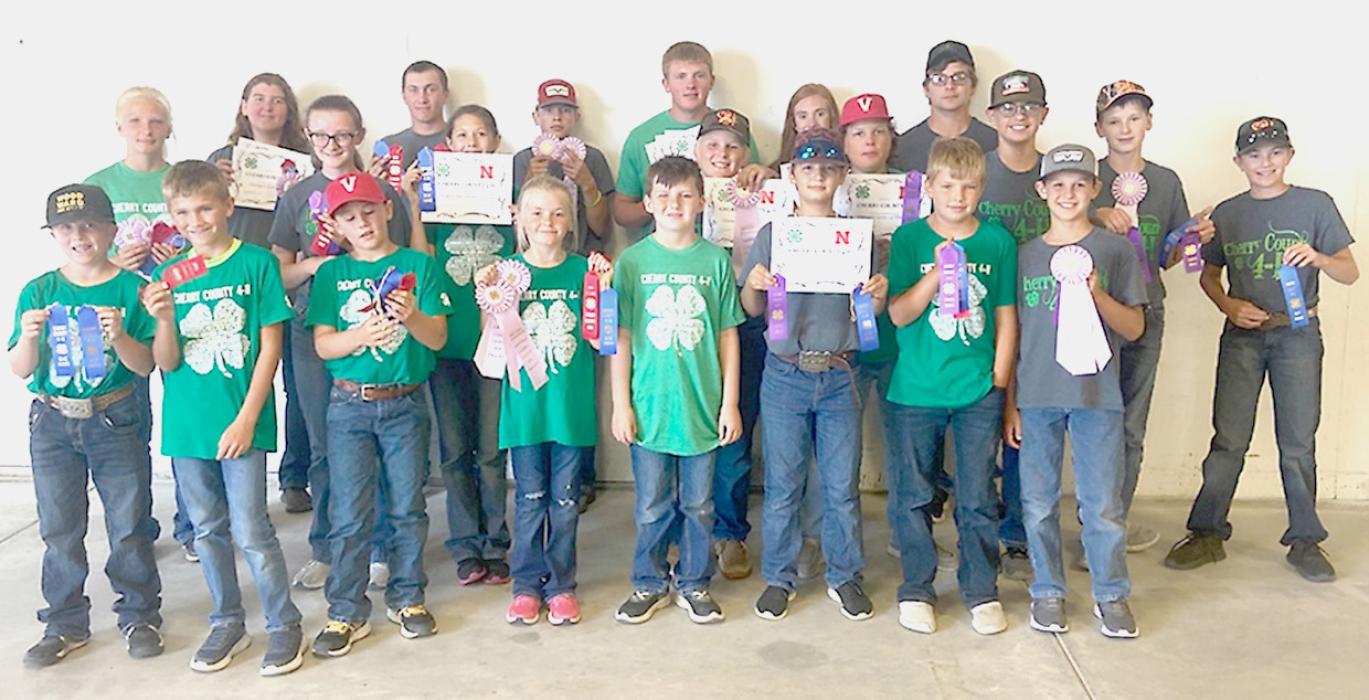 4-H Shooting Sports competitors are pictured, back row, L to R: Christen Larson-Malard, Jenalee Garwood, Brodie Stengel, Kaden McNare, Dylan Naslund, Ayden Naslund, Austyn Kieborz. Middle row, L to R: Madysyn Bopp, Josie Shaul, Hunter Harms, Jaeden Garwood, Greyson Hollopeter-Swan, James Walkling, Connor Simmons. Front row, L to R: Kross Kasner, Eli Huddle, Tilden Foster, Kayleigh Harms, Cash Jenkins, Kaden Garwood, Parker Wackler, Carson Walkling.