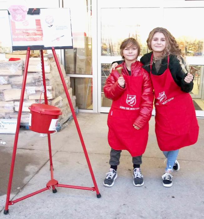 Badger Paw students volunteering to ring at Bomgaars.
