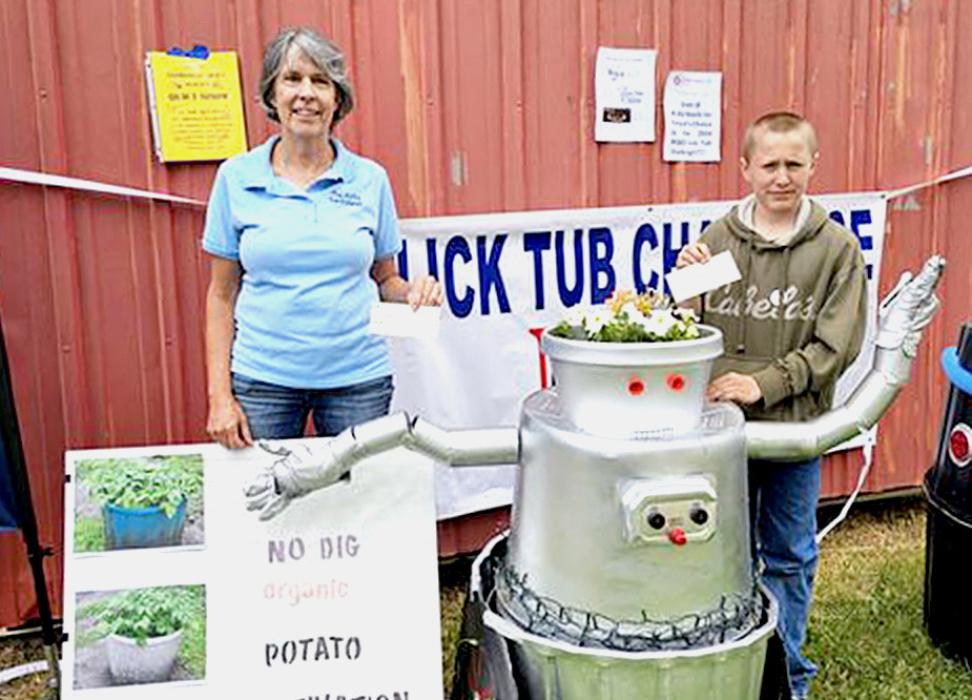 Pictured are winners of the Lick Tub Challenge, Sarah Joy of Bristow with her potato farm; and John Connell of Long Pine.