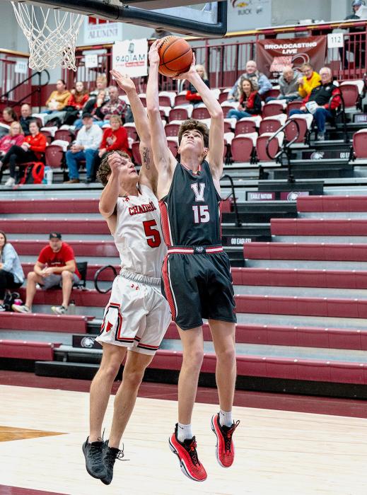 Isaac Cronin #15 going for the shot.