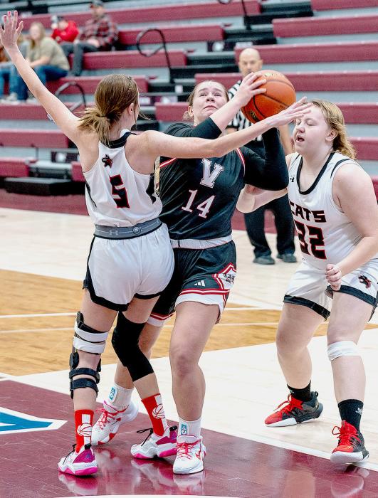 Kimber McGinley #14 working through her defenders to get to the basket. Photos by Fletcher Larsen
