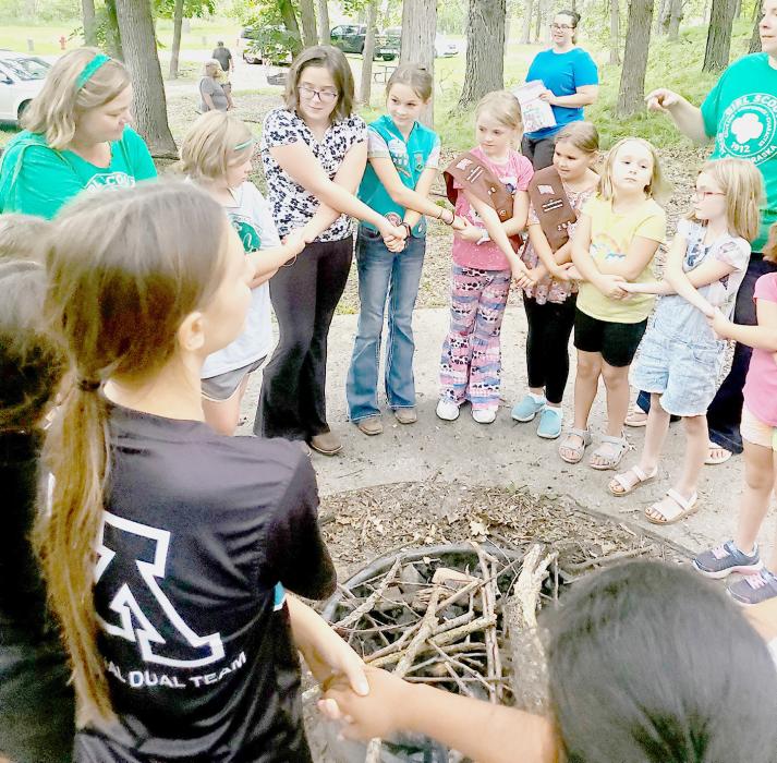 Showing solidarity to each other and Girl Scouts as a whole, is the friendship circle at the Girl Scout Cabin in Valentine City Park.