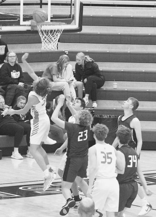 Nathan Perrett taking a shot, against Custer in the Chadron Holiday Tournament. Photos by Mary Reagle