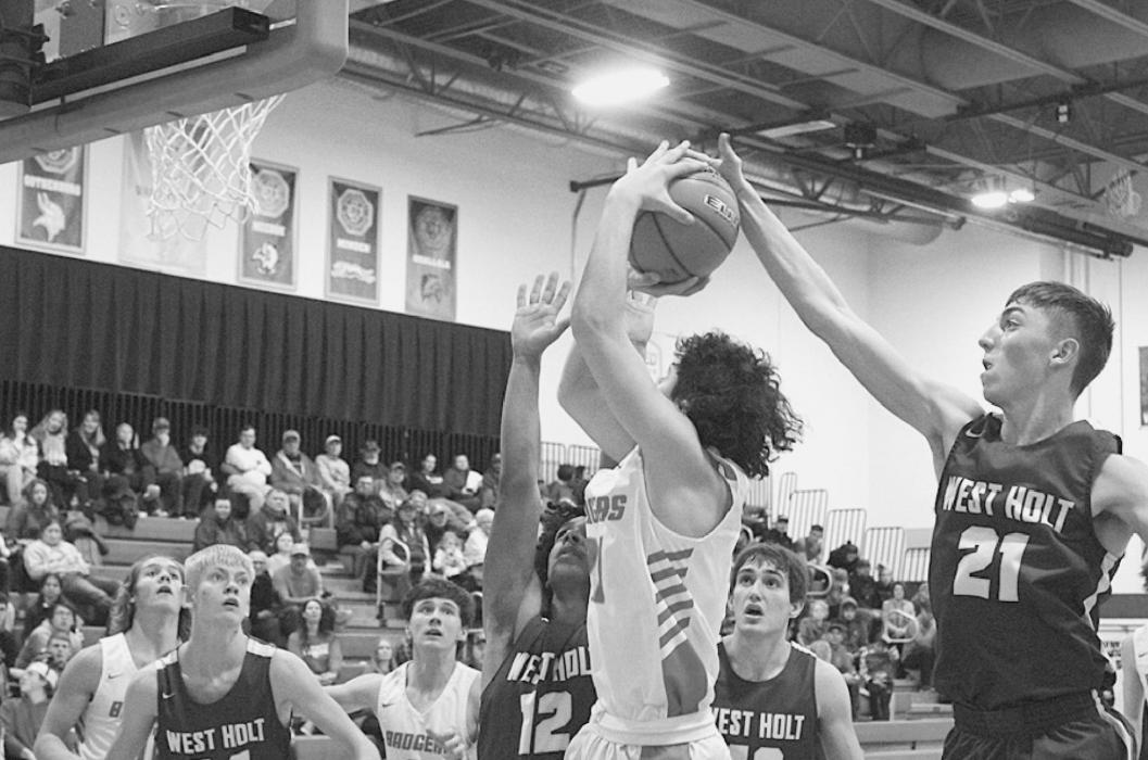 Andon Olson shooting under the basket in the game against West Holt in Valentine.