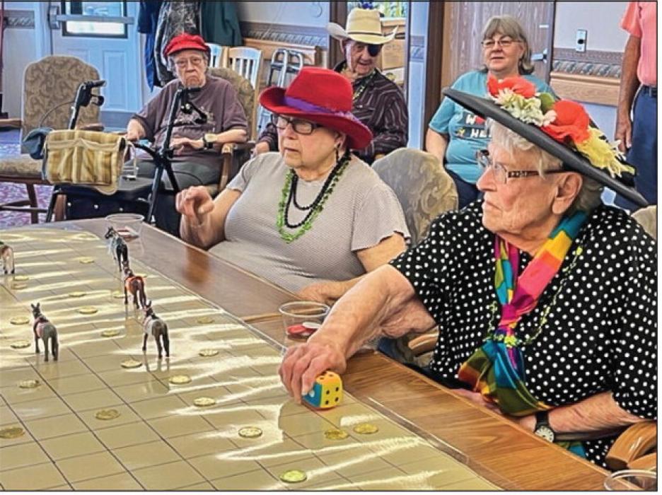 Everyone was a winner at the seventh annual Kentucky Derby, celebrated at Cherry Hills. Look at those ponies racing down the track! Photo by Sally Conner