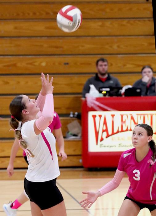 Libero Kimber McKinley setting the ball. Photo by Nina Nelson