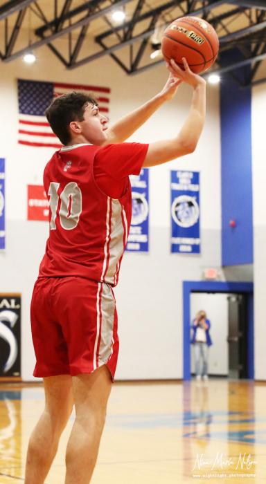 Caden Stankoski #10 up for 3 pointer.