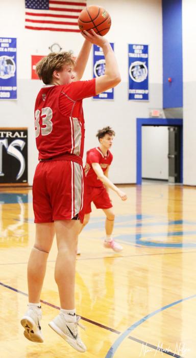 Aiden Buckendahl #33 shooting for 3 points.
