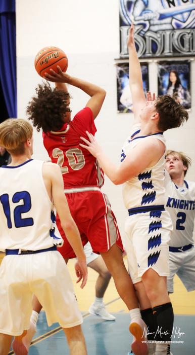 Jackson Huggins #20 battling for a shot against the Knights. Photos by Nina Maria Nelson