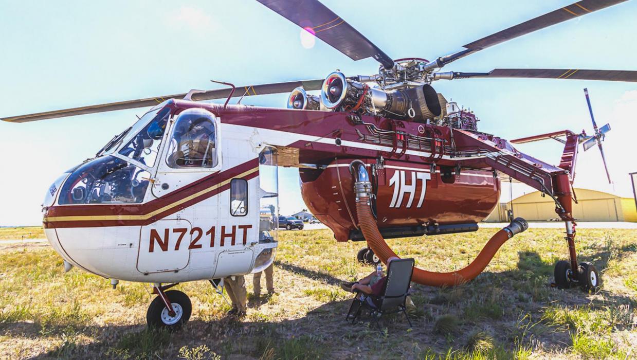 Above is a 1967 retrofitted crane helicopter that was used in the St. Francis, SD fire. Notice the middle part is missing - that’s on purpose. The bladder that holds 3,000 gallons of water can be removed so a lifting mechanism can be installed, and the helicopter can then lift heavy objects such as an air conditioning unit on a high rise, or transmission lines. Photos by Laura Vroman