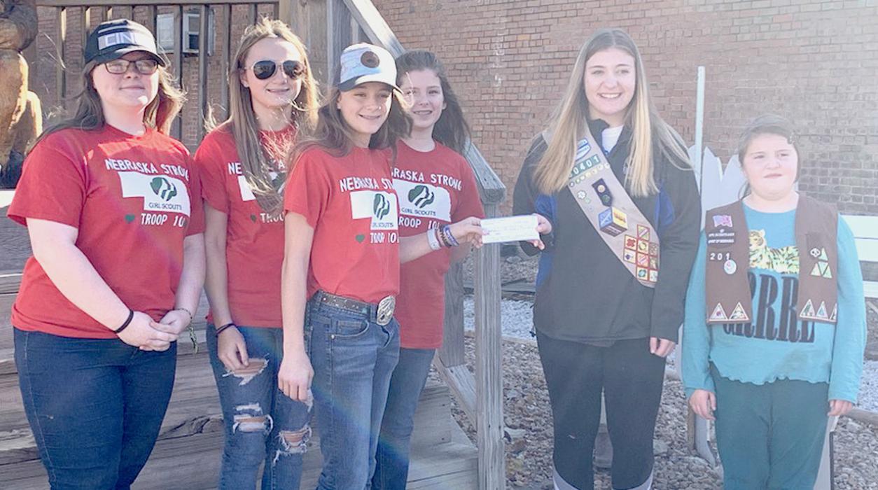 In the fall of 2020, Girl Scouts from Valentine Troop #101 presented a check for Nebraska Flood Relief to the Girl Scout Troop in Verdigre. The funds were collected for Valentine Troop #101 Silver Project and were used for community restoration. Pictured are from L to R: Emma Kreutner, Zoey O’Kief, Hailey Witte, Marybelle Ward and two members of the Verdigre Girl Scout Troop.
