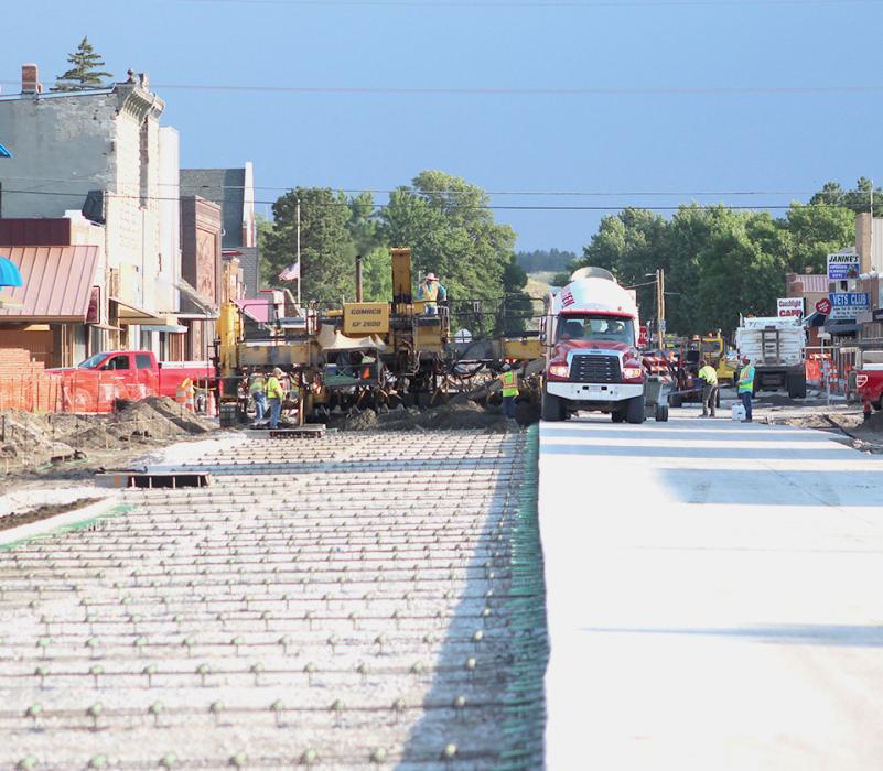 Paulsen, Inc., pouring the southbound lane of the 100 block of Main Street. The baskets contain dowel bars which act as a reinforcement between the panels for movement as they shift.
