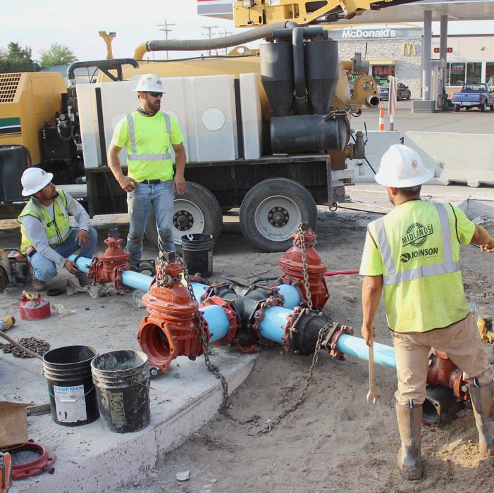 Midlands, Inc., is assembling a valve intersection at Main Street and Highway 20. The water main and ductile iron fittings shown will tie the existing main to the new water main.