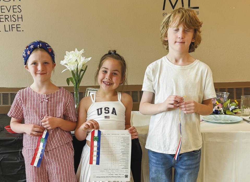 Pictured for Clover Kid Table Setting are Phoebe Gordon, Isa Foster, and James Cochran.