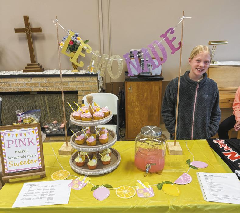 Pictured with Cupcake Display is Marlie Burge.