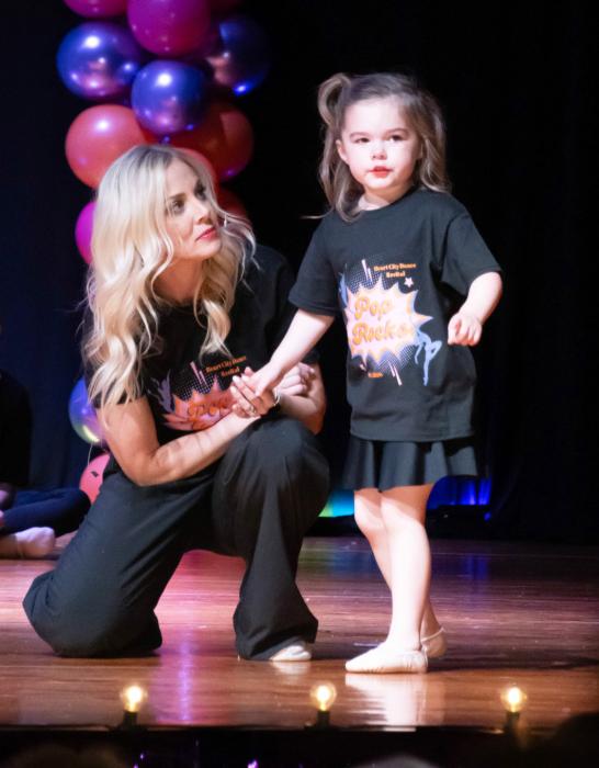 Teacher Amy Arganbright was giving her closing sentiments, when this little one wanted the spot light turned off because she couldn’t see the audience ~ quite a response from the crowd for her speaking up.
