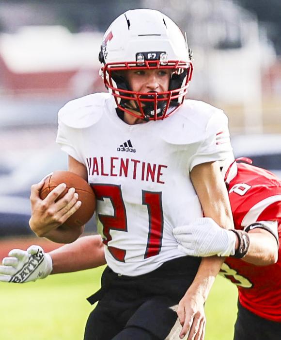Ty Benson # 21 carrying the ball. Photos by Julie Liddy