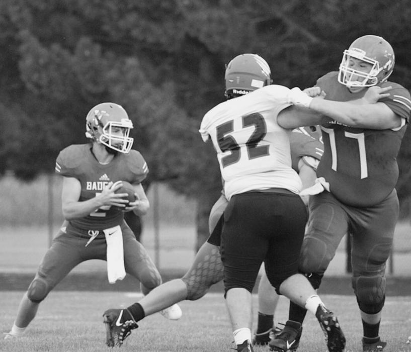 Ashton Lurz #2 quarterback Steven Fullerton #77 blocking