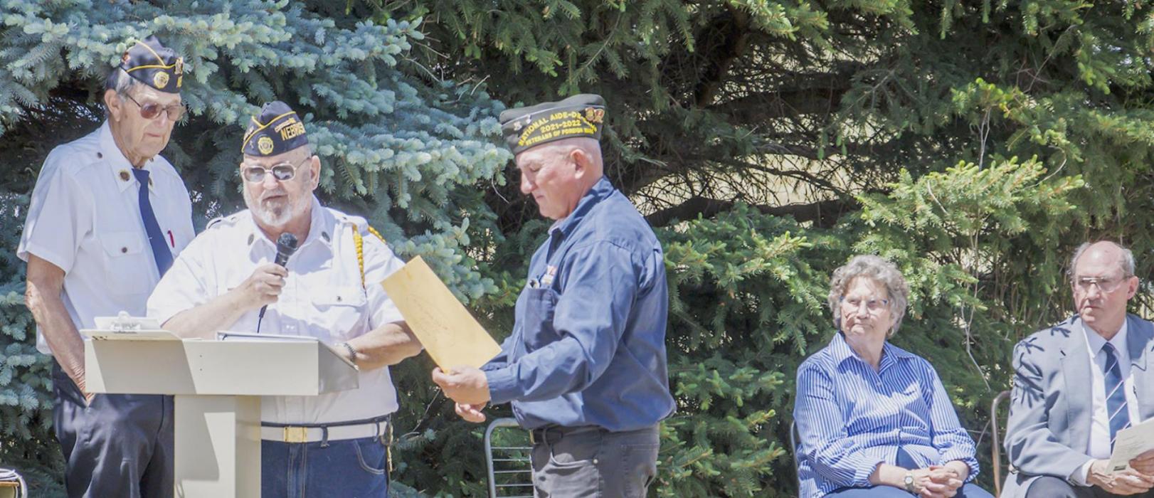 Pictured are from L to R: Legion Adjutant Walter Ries, Jr., Commander Joe Kreycik, guest speaker Rex Gallino, Anna May Letellier, and Pastor Letellier.