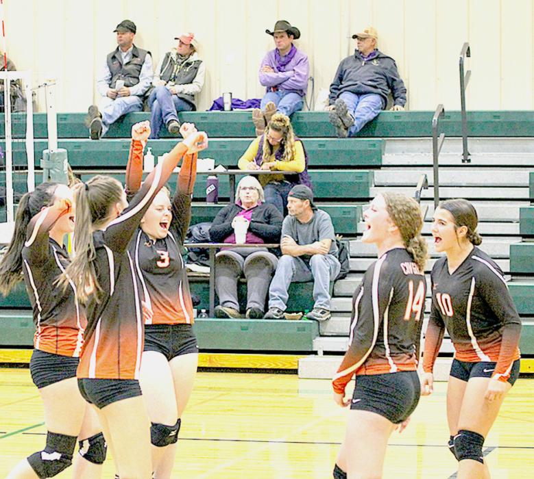 Cowgirls celebrating after a long rally against the Warriors. Photos by Shontell Roseberry