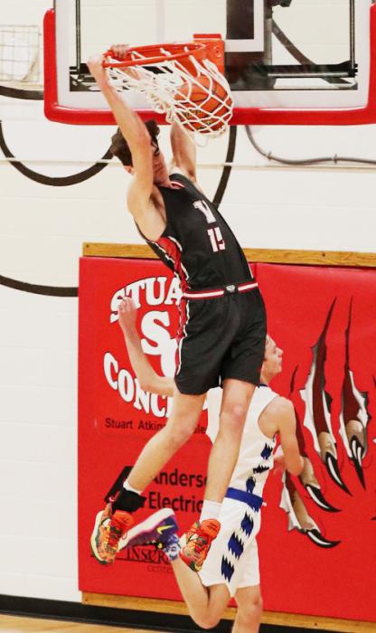Isaac Cronin #15 dunks the left side!! Photos by Nina Maria Nelson