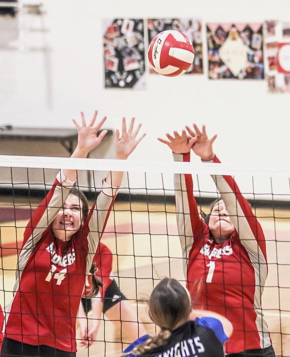Lainey Egelhoff and Malika Monroe guard the net in the game against the North Central Knights. Photo by Amanda Long