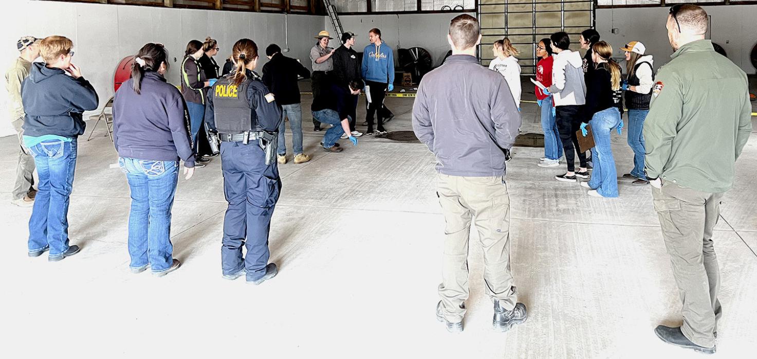 Agencies along with students are debriefing the scene. Photo by NPS/B.Roshone