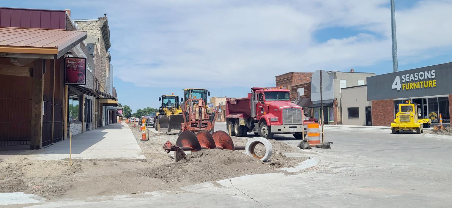 Sidewalks are being poured in front of Main Street businesses as the construction continues ahead of schedule. Photo by Laura Vroman