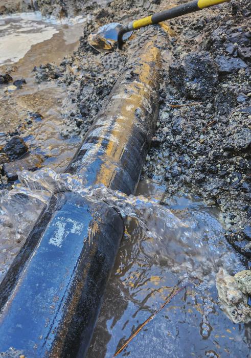Water gushes from a broken main on Lakeshore Drive.