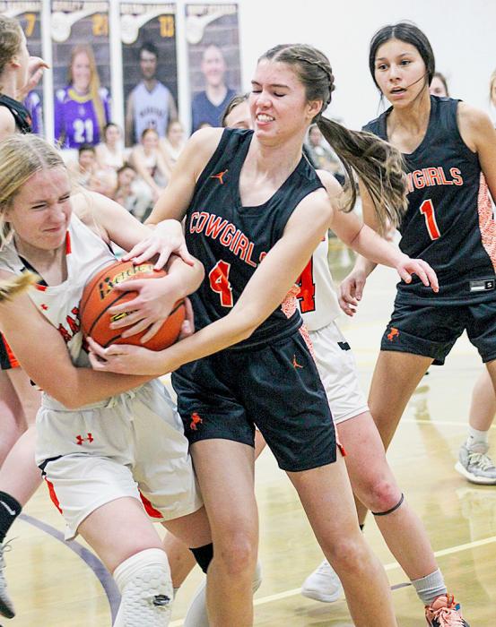 Cowgirl Kate Cox #4 fighting for a ball at Sioux County. Photos by Shontell Roseberry