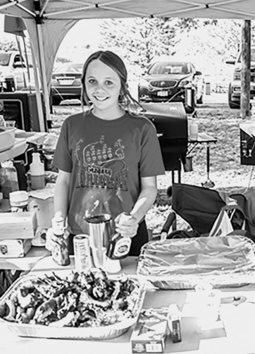 Abby Holmes was the People’s Choice winner for her ribs at the annual Chaduza Cook-off. More winners and fun on the back page!