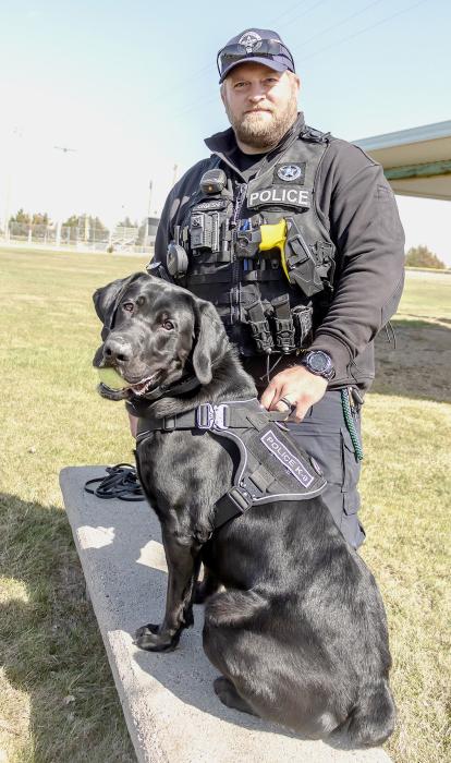 K-9 Baker and Officer Brandon Ormesher are pictured above. K-9 Baker joined the Valentine Police Department in October and was certified in January. Below, K-9 Baker alerts to Ormesher that he’s found something - a plastic gun, in this case - used for training purposes. Photos by Laura Vroman