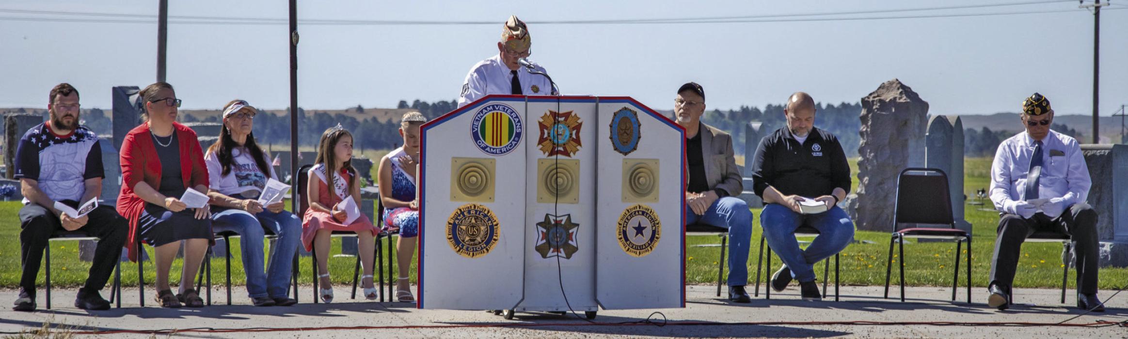 The gathering at Mt. Hope Cemetery in honor of our fallen, who died so that we may have freedom every day. Pictured are from L to R: Justin Hartman, Michelle Garwood, Bonnie Price, Kaylee Luthy, Isa Foster, Rex Gallino, Pastor Tim Wilkinson, Pastor Jake Schadel, and Don Nelsen. Photos by Tina Boone
