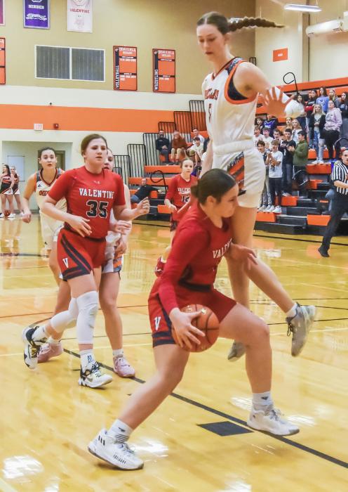 Jayda From #13 moves by her defender as she comes down the court in Southwest Conference play against Ogallala. Photo by Kris Larsen