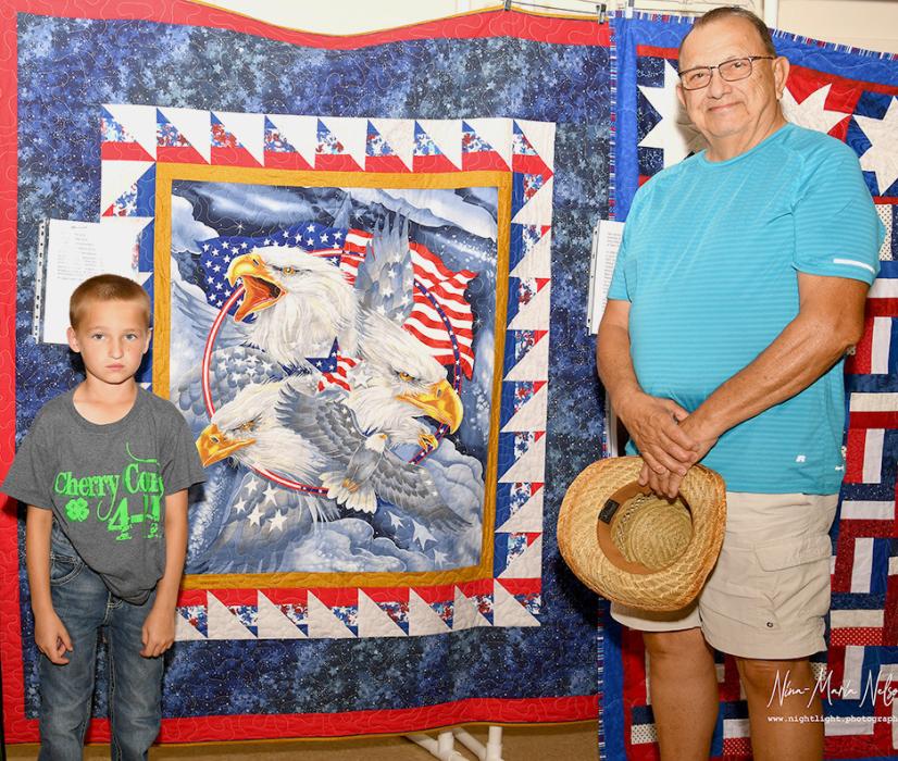 Case Larson presents Mike Librato with his Quilt of Valor.