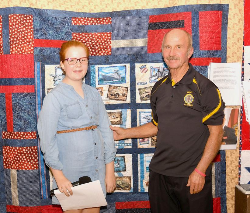 Brooke Brashears presents Michael “Mike” Helm with his Quilt of Valor.