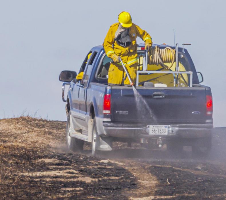Keeping the fire at bay on the Cut Across Road fire, Tuesday, March 22, 2022. Photos by Laura Vroman