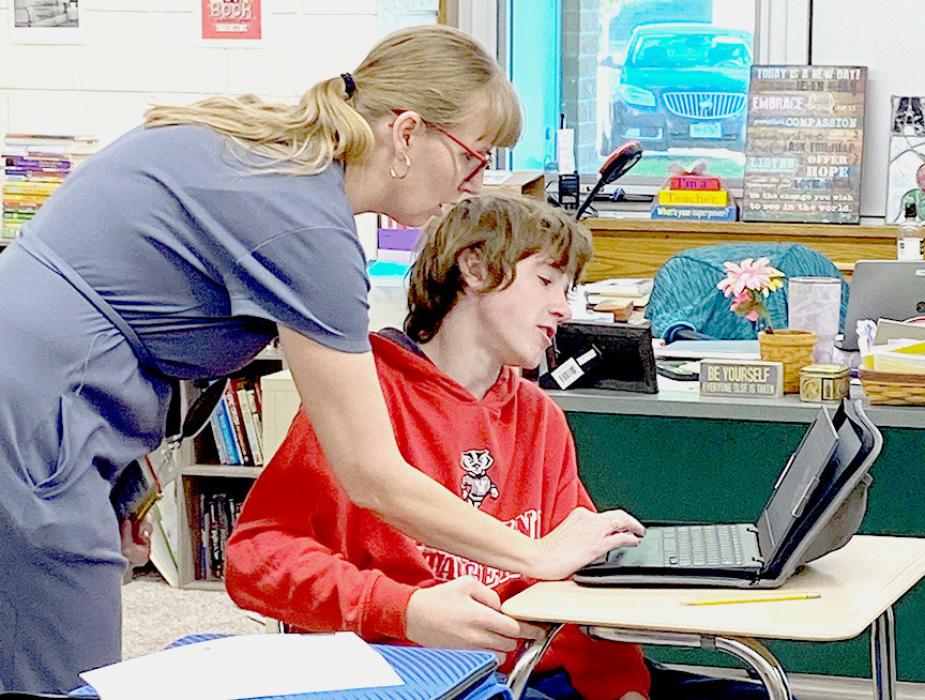 Mrs. Stoeger is seen helping one of her students at VMS.