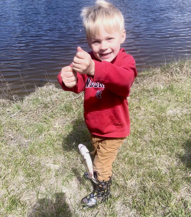 Holding up his catch of the day!